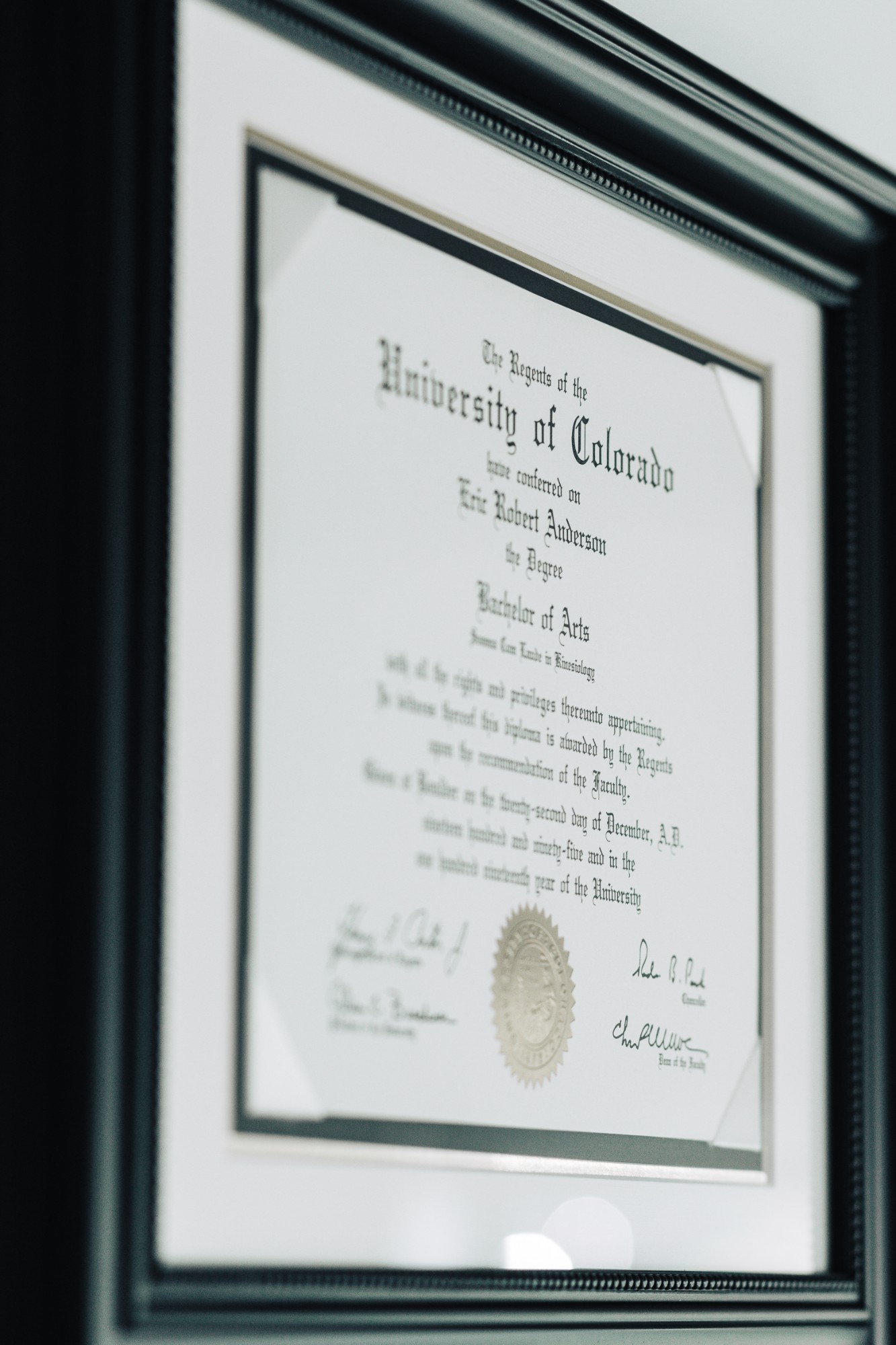 Framed physician credentials at Ridgepoint Performance Medicine