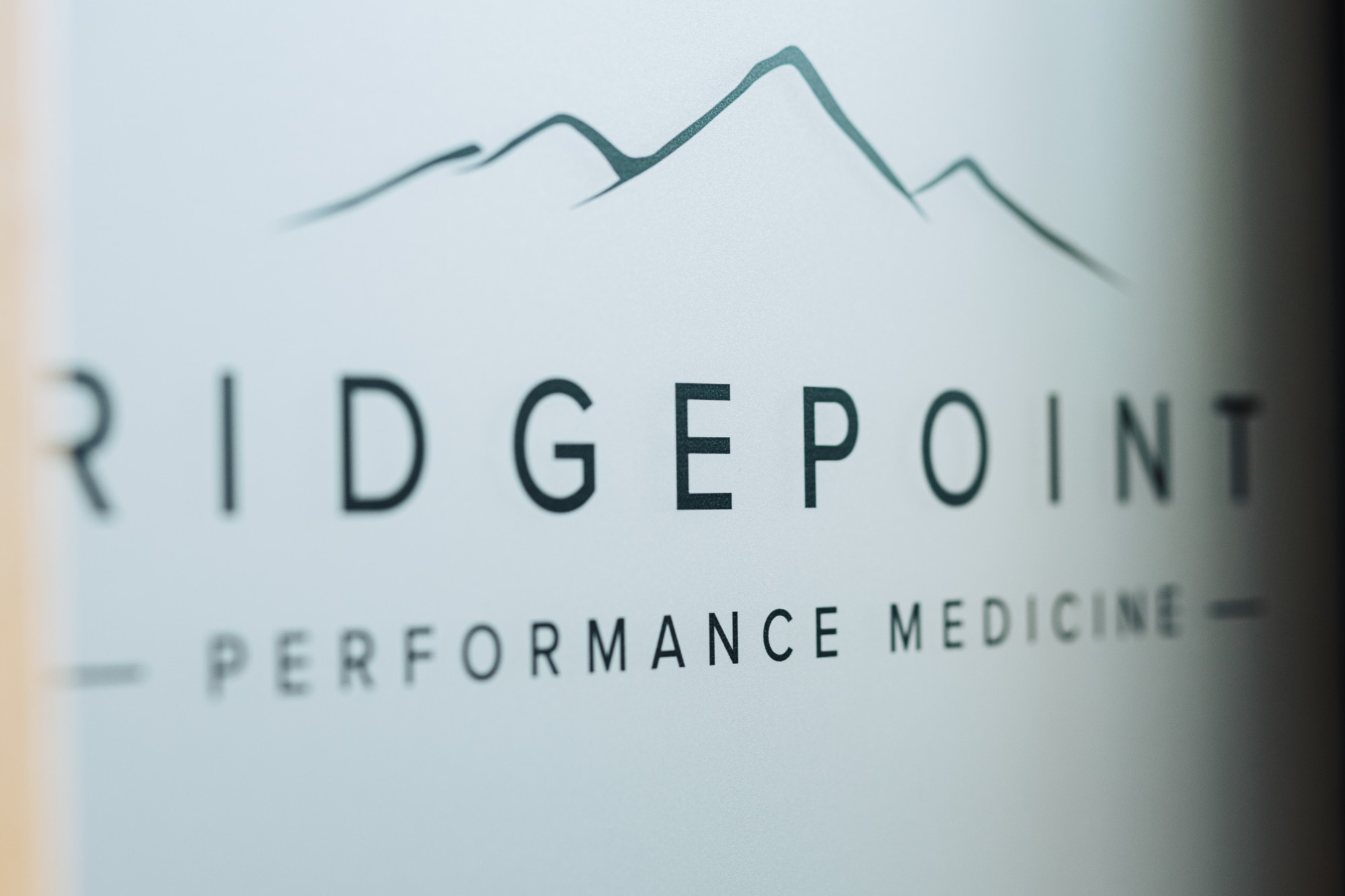 Ridgepoint Performance Medicine logo etched on glass